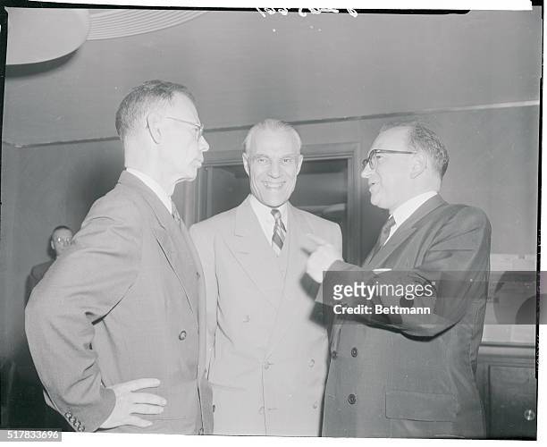Undersecretary of State Walter Bedell Smith is shown conferring with Gen. Paul Ely French commissioner general in Indochina and French Finance...