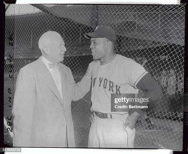 Tris Speaker , probably the greatest center fielder in baseball history, chats with the New York Giants ace center fielder Willie Mays. Modern...