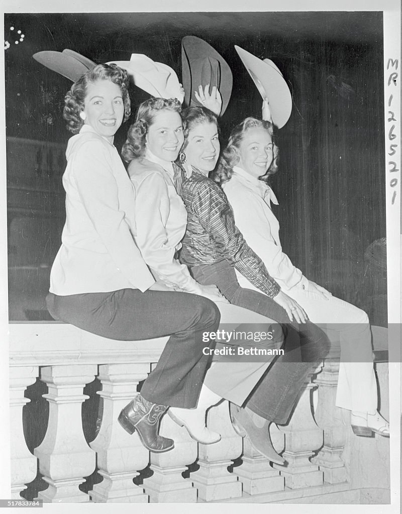 Cowgirls Sitting on Banister