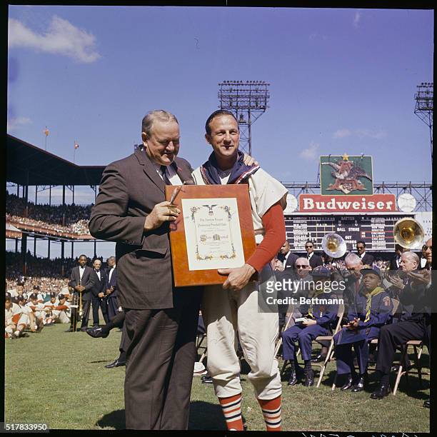 St. Louis, Mo.: American League President Joe Cronin presents the League's Expression of Esteem Award to Stan Musial, during pre-game ceremonies...