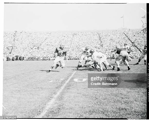 Jim Morse, of Notre Dame seems to be shouting for plenty of action as he returns a kick 28 yards in the first quarter before being knocked out of...