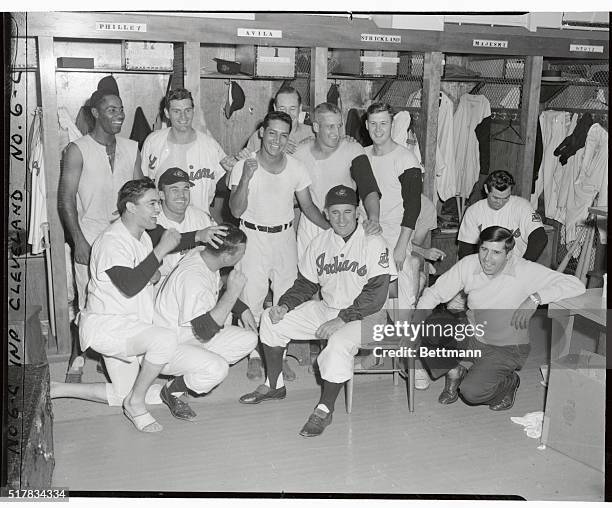 Whooping it up in the dressing room are a group of Indians celebrating their uphill 5-4 triumph over the Philadelphia A's in the eleventh innig which...