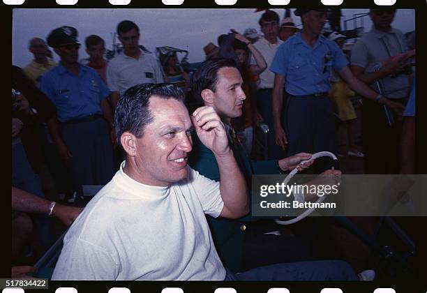 Bob Goalby being driven by the Masters Official after his first round of play.