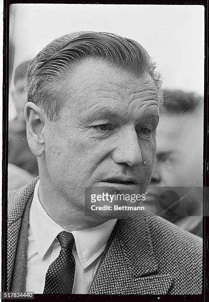 Serious Governor Nelson Rockefeller answers reporters' questions after casting his ballot in general election. Sources in Albany said that the...