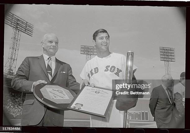 Members of the Boston Red Sox hold their awards that were presented to them prior to their opener with Detroit at Fenway Park 4/16. L-R Jim Lonborg,...