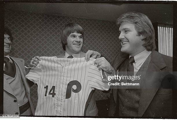 The newest Philadelphia Phillies, Pete Rose, looks over his new team shirt at a press meeting here in Philadelphia December 12th. This is Rose's...