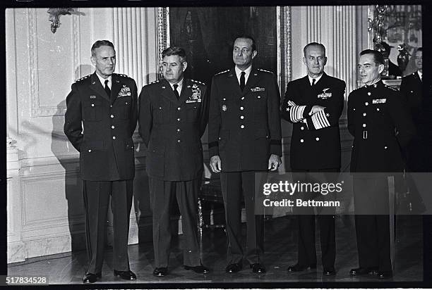 The Joint Chiefs of Staff with President Johnson are from left to right; General David M. Shoup, of the Army; Admiral David L. McDonald of the Navy,...