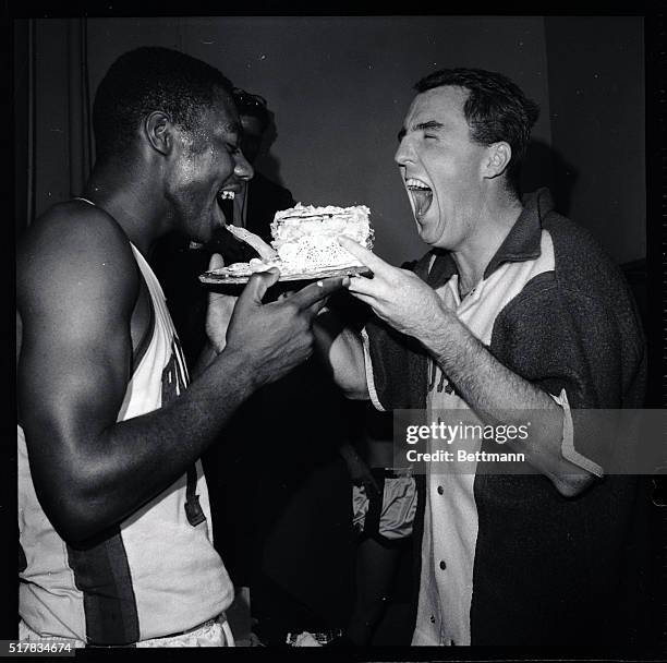 Cincinnati's Jack Tyman and Oscar Robertson whoop it up over a birthday cake to celebrate Robertson's 25th birthday 11/26. The players celebrated in...