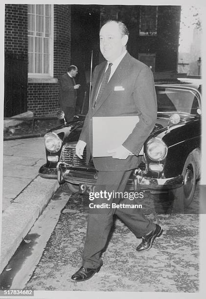 Arriving at No. 10 Downing Street here today for the first cabinet meeting called by the new Premier Lord Home, is Mr. Christopher Shames who retains...