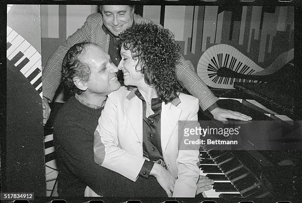 New York: Actress-singer Chita Rivera rubs noses with composer Charles Strouse and co-producer Lee Guber during a press conference at "On Stage"...