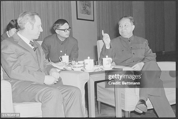 Chinese Premier Hua Guofeng gestures as he talks with U.S. Treasury Secretary W. Michael Blumenthal during their meeting Feb. 28th, in the Great...