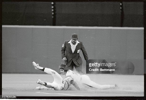 Astros Art Howe stretches to tag out Phils' Pete Rose at second base as Rose was trying to stretch a single into a double in the first inning here...