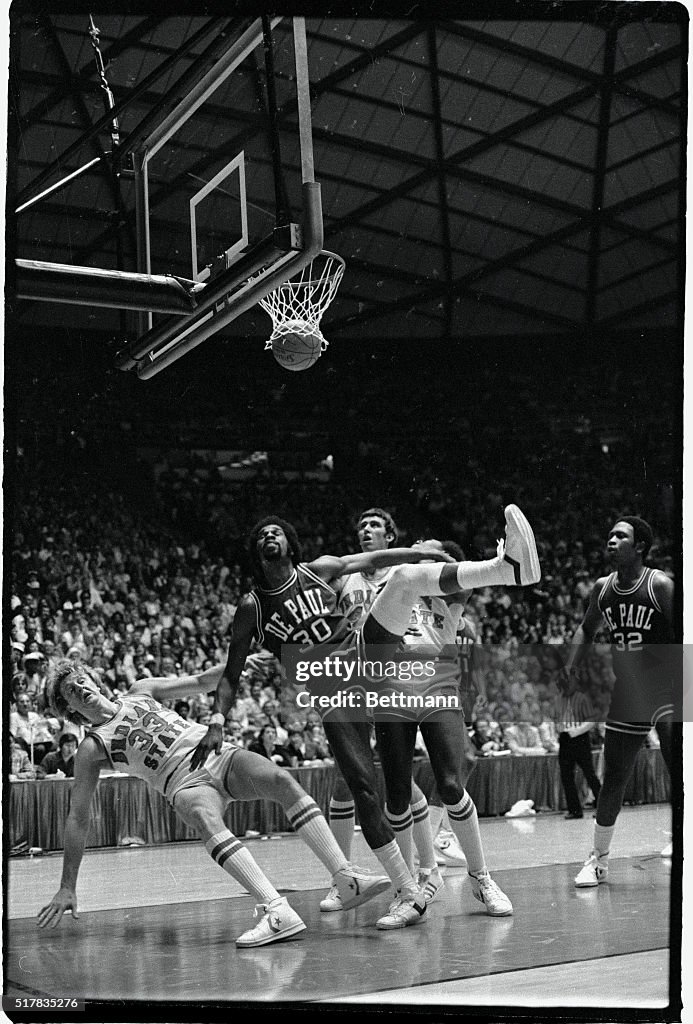 Larry Bird Falling to the Floor During Game