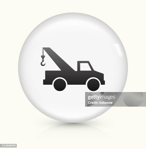 towing truck icon on white round vector button - tow truck icons stock illustrations