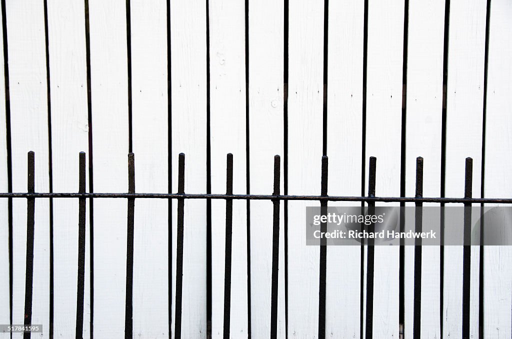 High Contrast Fence Against White Wall