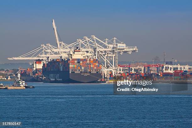 container ship loading in port-bayonne. - bayonne new jersey stock pictures, royalty-free photos & images