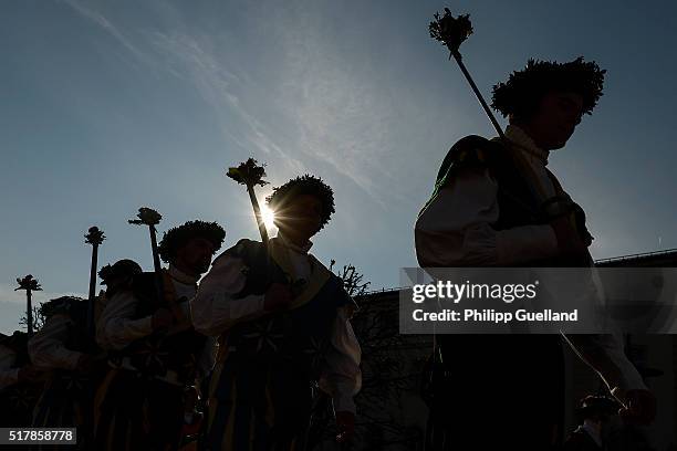 Silhouettes are seen of dancers dressed in traditional clothes perform the "Schwertertanz" during the annual Georgi-Ritt Easter Monday procession in...