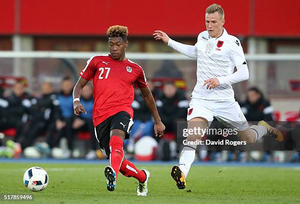 David Alaba of Austria moves away from Bekim Balaj during the international friendly match between Austria and Albania at the Ernst Happel Stadium on...