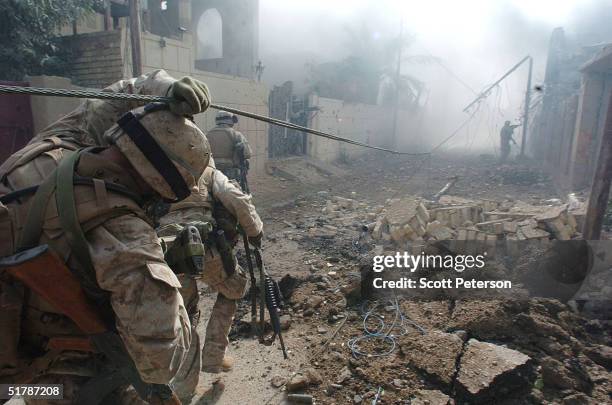 Stepping back into the battlefield, U.S. Marines of the Light Armored Reconnaissance company of 1st Battalion 3rd Marines, clear houses at the site...