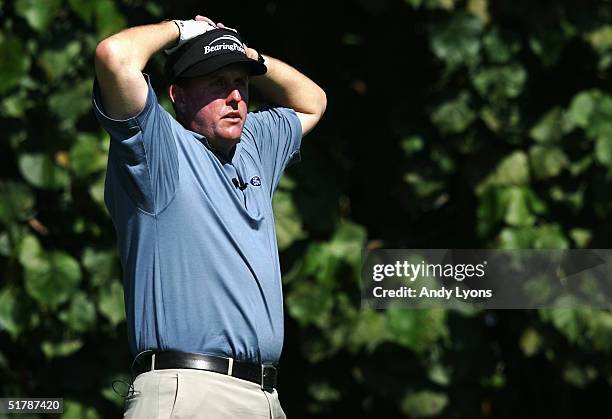 Phil Mickelson waits to hit his tee shot the 11th hole during day 1 of the 22nd PGA Grand Slam of Golf on November 23, 2004 at the Poipu Bay Golf...