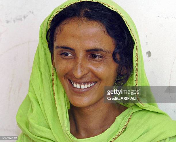 This picture taken 31 August, 2004 shows Mukhtar Mai giving an interview to AFP in the village of Mirwala, 460 kilometers south of Islamabad. Mai,...