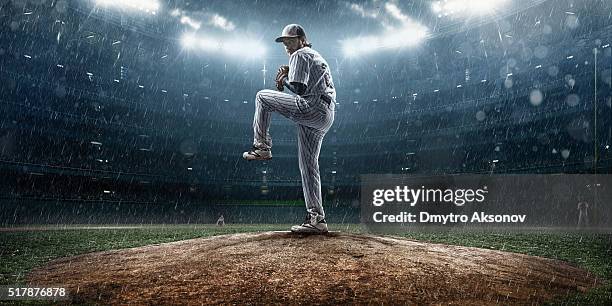 baseball pitcher in action - baseball pitcher close up stock pictures, royalty-free photos & images