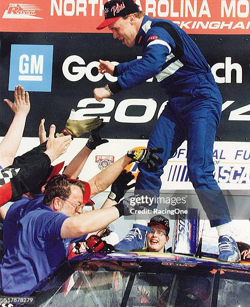 Matt Kenseth driver of the Reiser Enterprises Chevrolet celebrates in victory lane after winning the 1998 GM Goodwrench Service Plus 200 at the North...
