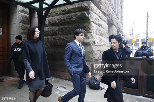 Former CBC Radio host Jian Ghomeshi leaves court on Thursday, March 24 after Ontario Court Justice William Horkins found him not guilty of sex...