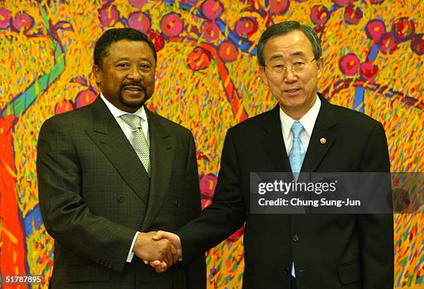 General Assembly President Jean Ping talks with South Korean Foreign Minister Ban Ki-Moon before a meeting at Ban's office November 24, 2004 in...