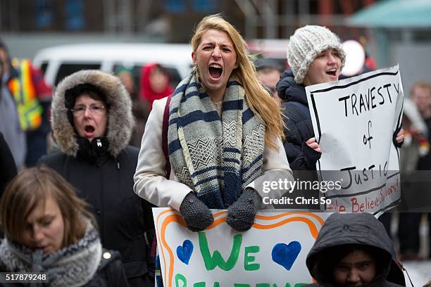 Demonstrators shout their support during a chant session. Ryerson Unversity's Centre for Women and Trans People staged a rally at Old City Hall in...