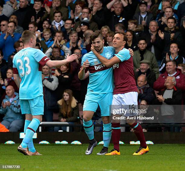 Taylor Tombides celebrates scoring with Mark Noble of West Ham United during the Mark Noble Testimonial match between West Ham United XI and West Ham...