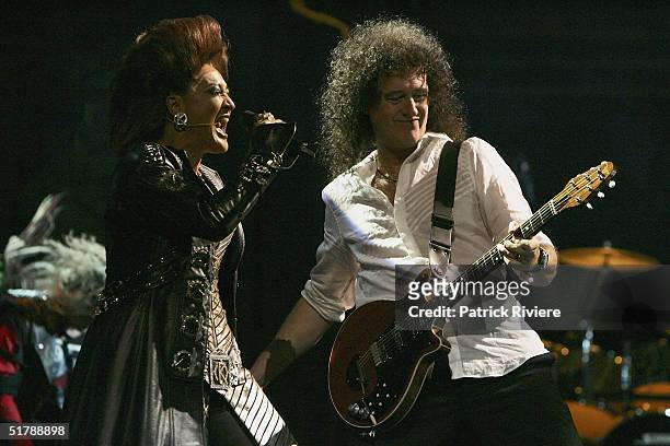 Original member Brian May performs for the first time on stage with Anne Crummer from the new cast of "We Will Rock You" at the Lyric Theatre October...