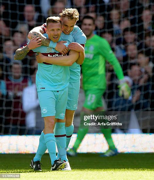 Craig Bellamy and Jack Collison celebrate the first goal during the match between West Ham United XI v West Ham United All Stars XI: Mark Noble...