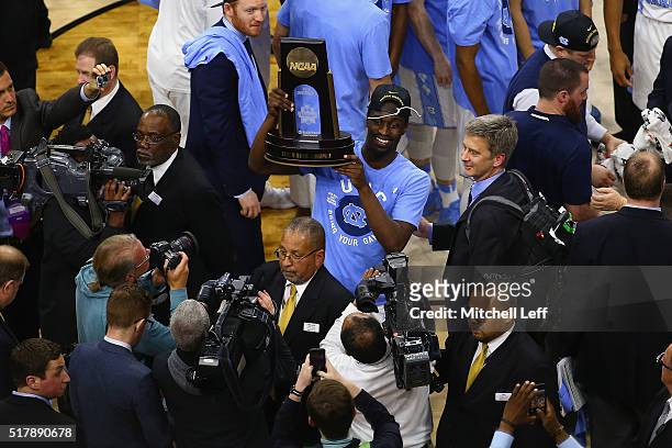 Theo Pinson of the North Carolina Tar Heels celebrates after defeating the Notre Dame Fighting Irish with a score of 74 to 88 in the 2016 NCAA Men's...
