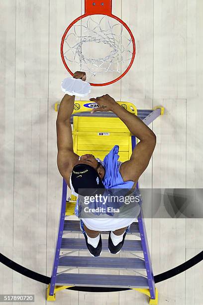 Kennedy Meeks of the North Carolina Tar Heels celebrates after defeating the Notre Dame Fighting Irish with a score of 74 to 88 in the 2016 NCAA...