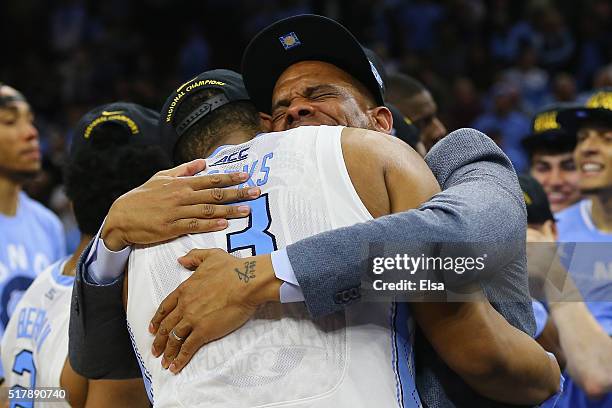 Kennedy Meeks of the North Carolina Tar Heels celebrates after defeating the Notre Dame Fighting Irish with a score of 74 to 88 in the 2016 NCAA...