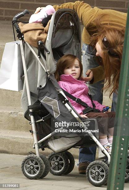 Julianne Moore walks with her two-year-old daughter Liv Helen Freundlich in midtown October 24, 2004 in New York City.