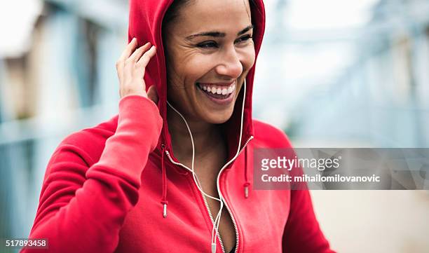 smiling during workout - hood clothing stock pictures, royalty-free photos & images