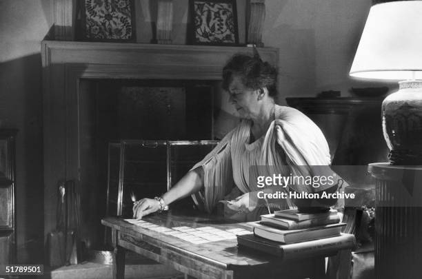 British explorer and writer Freya Stark , playing solitaire or patience at her home in Asola, Italy, May 1957.