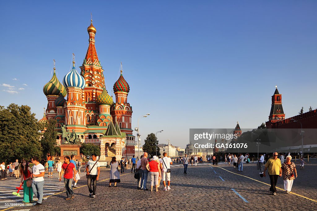 People walking about in Red Square at sunset