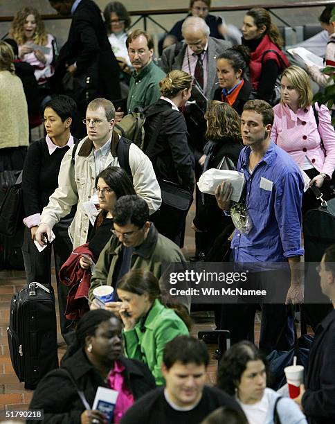 Travelers wait-in-line to board Amtrak trains at Union Station during peak hours of travel marking the beginning of the Thanksgiving holiday weekend...