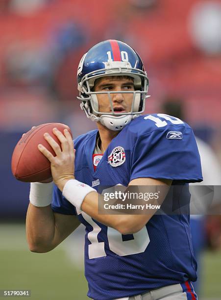 Quarterback Eli Manning of the New York Giants warms up before the game against the Atlanta Falcons at Giant Stadium on November 21, 2004 in East...