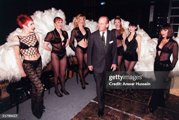 Prince Philip, the Duke of Edinburgh meets members of the cast of Chicago during a visit to the Adelphi Theatre in this March 4, 1999 file photo in...