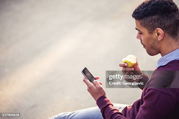 having a snack - snacking on the go stock pictures, royalty-free photos & images