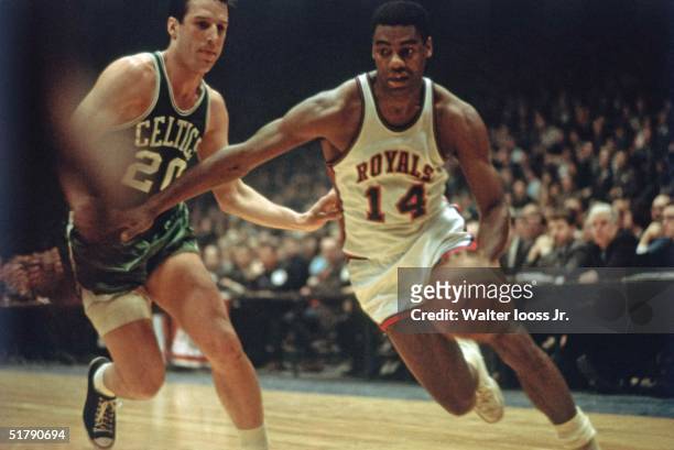Oscar Robertson of the Cincinnati Royals drives against the Boston Celtics during the NBA game in Cincinnati, Ohio. NOTE TO USER: User expressly...