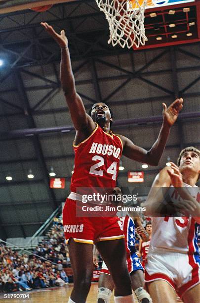 Moses Malone of the Houston Rockets goes for a layup against the New Jersey Nets during the NBA game in New Jersey. NOTE TO USER: User expressly...