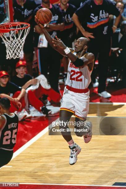 Clyde Drexler of the Houston Rockets goes for a layup against the San Antonio Spurs during the NBA game in Houston, Texas. NOTE TO USER: User...