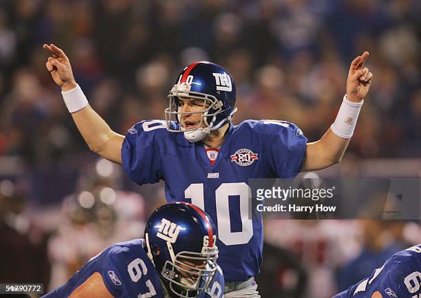 Quarterback Eli Manning of the New York Giants calls signals at the line of scrimmage during the game against the Atlanta Falcons at Giant Stadium on...