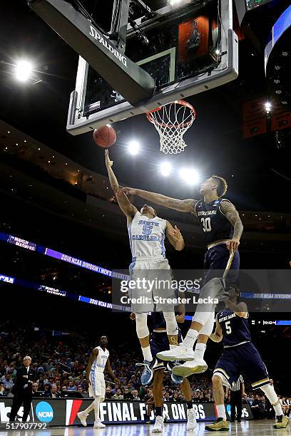 Marcus Paige of the North Carolina Tar Heels shoots the ball against Zach Auguste of the Notre Dame Fighting Irish during the 2016 NCAA Men's...