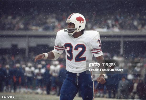 Simpson of the Buffalo Bills watches the finish of a play at Shea Stadium in Flushing, New York.